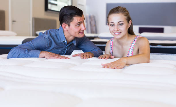istock married couple choosing new mattress 809860304