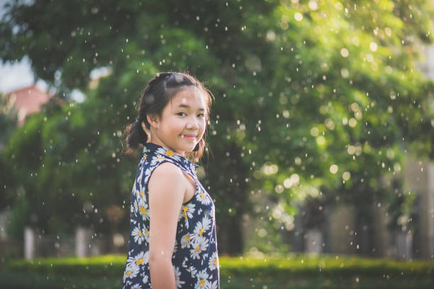 istock Asian girl under the rain 809861038