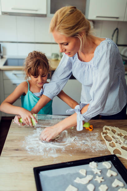 istock Mother and Daughter Making Cookies 809864446