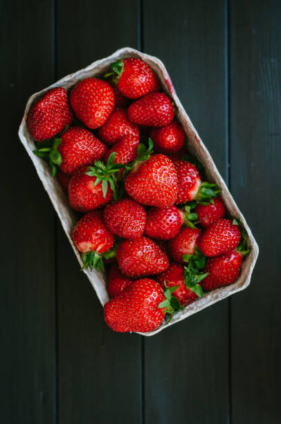 Strawberries on black table stock photo