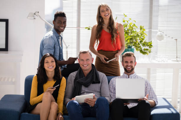 istock Business colleagues using electronic devices in the office 809865720