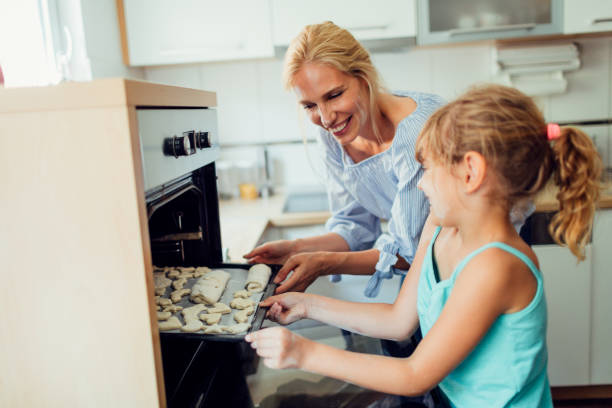 istock Mother and Daughter Making Cookies 809868934