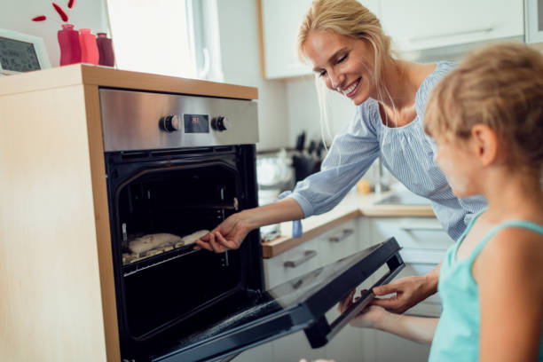 istock Mother and Daughter Making Cookies 809869186