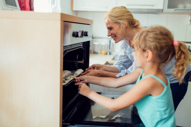 istock Mother and Daughter Making Cookies 809869196