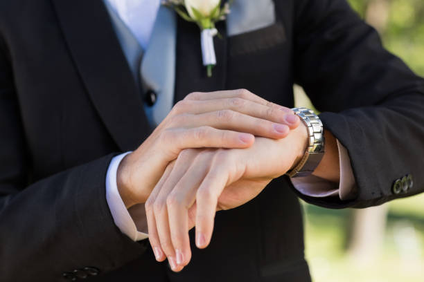 istock Midsection of groom checking time 809869960