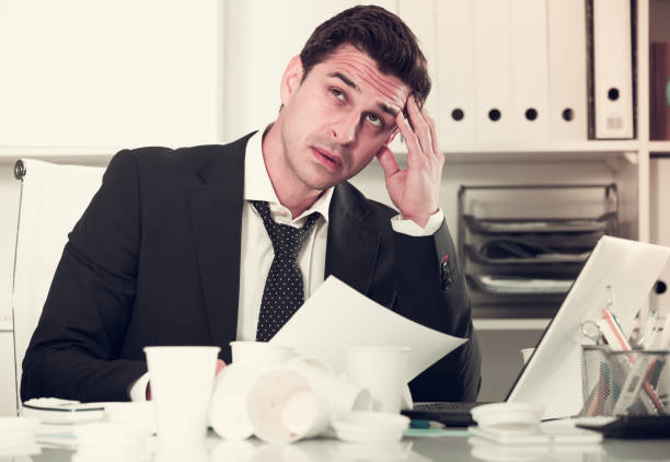 istock Businessman feeling thirsty in hot office 809872836