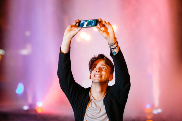 istock Young man take selfie on smartphone in city 809877980