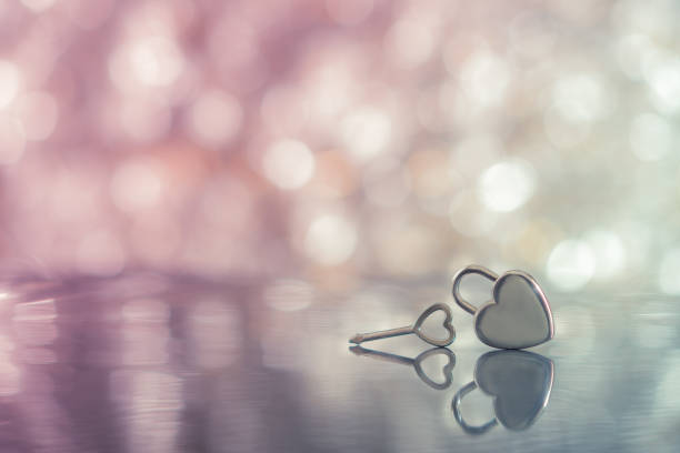 istock Heart lock and key on pink light bokeh background, love, dreamy and romantic theme 809882220