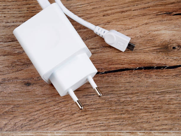 istock Mobile charger on wood background 809888074