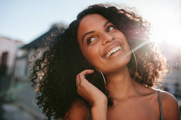 istock Afro american standing outdoors and smiling 809889144