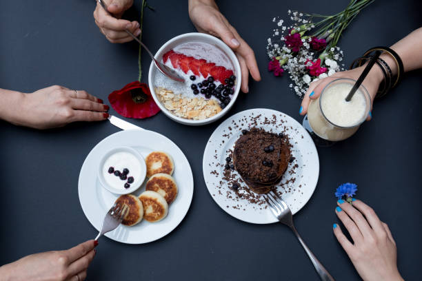 istock Cheesecake with sour cream, handmade. Pancakes on a black background. View from above 809916530