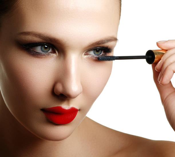 istock Mascara applying closeup, long lashes. Mascara brush. Eyelashes 809917876