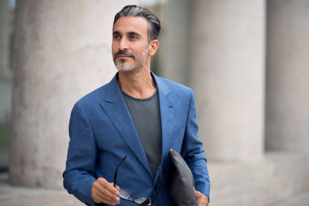 istock Portrait of handsome man looking away 809920520