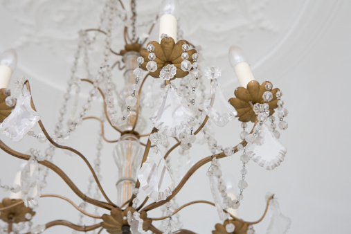 Chrystal chandelier close up. Glamour toed background with copy space