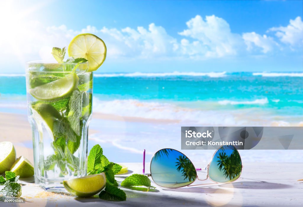 tropic summer vacation; Exotic drinks on blur tropical beach background Summer Stock Photo