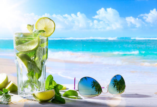 tropic summer vacation; Exotic drinks on blur tropical beach background tropic summer vacation; Exotic drinks on blur tropical beach background fiji photos stock pictures, royalty-free photos & images