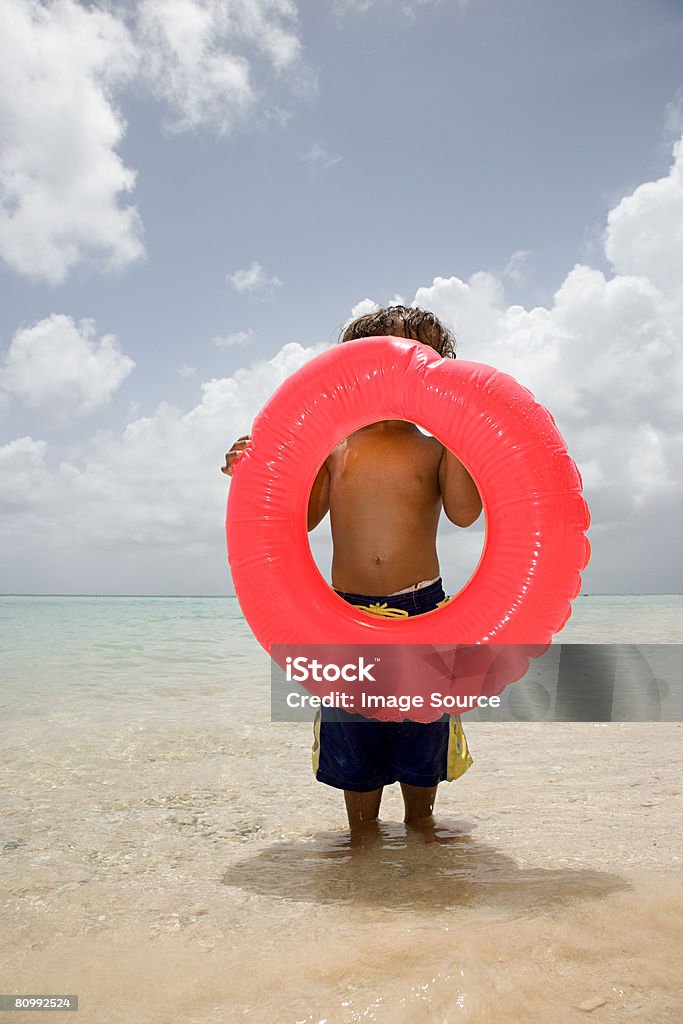 Boy with inflatable ring  Beach Stock Photo