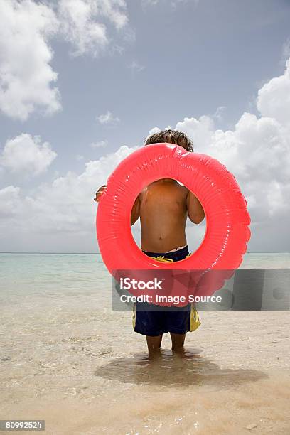 Boy With Inflatable Ring Stock Photo - Download Image Now - Beach, Boys, Child