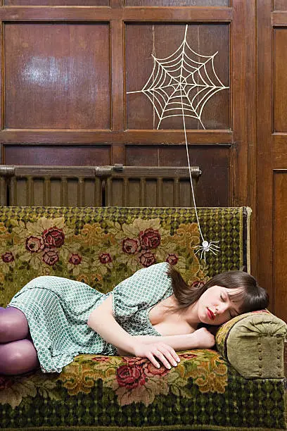 Photo of A spider and a teenage girl sleeping