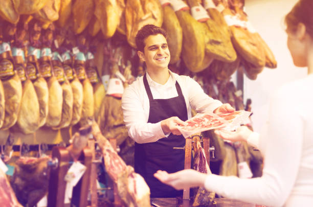 istock brunette choosing iberico and serrano jamon and smiling 809932738