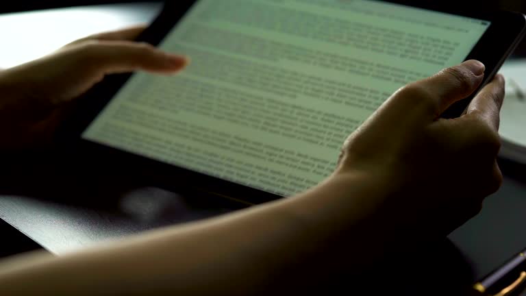 woman hand using tablet to reading on ebook