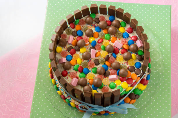 istock Multicolored birthday Pinata cake stuffed with sweets inside 809940260