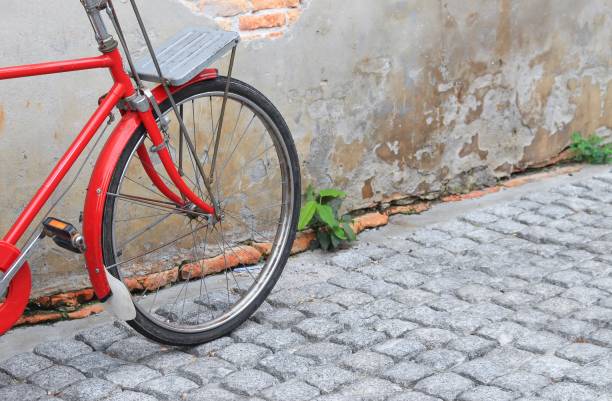 istock wheel for bicycle classic vintage in former on  pavement  with copy space for add text 809943552