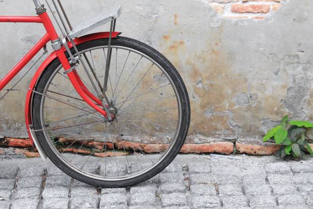 istock wheel for bicycle classic vintage in former on  pavement  with copy space for add text 809943616