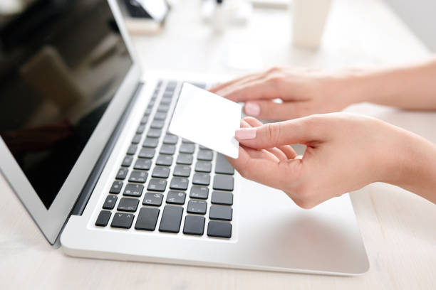 istock Young woman making payment by card 809963362