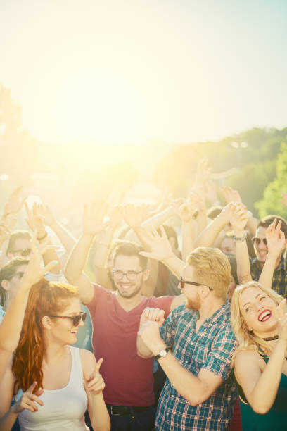 istock Crowd of people dancing at festival 809967548