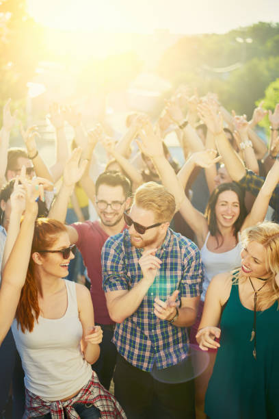 istock Crowd of people dancing at festival 809972162
