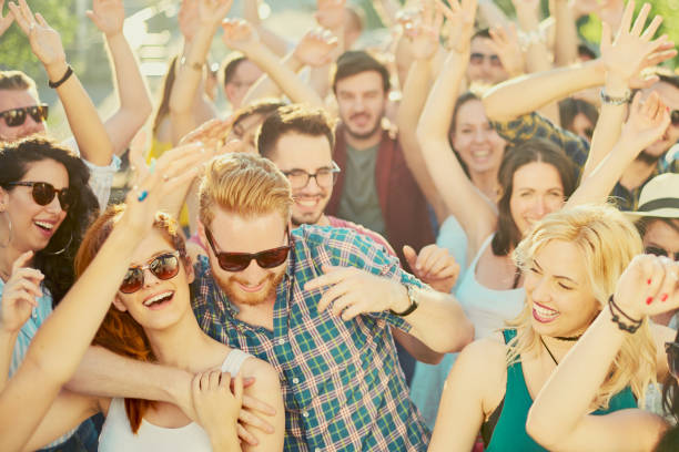 istock Crowd of people dancing at festival 809972286