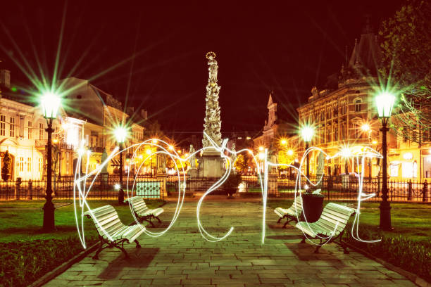 istock Plague column in Kosice, night scene, writing with light, red photo filter 809979298
