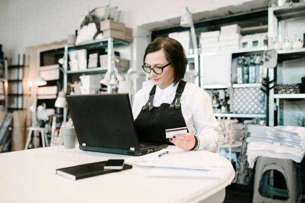 istock Business Owner Paying Bills Online 809979736