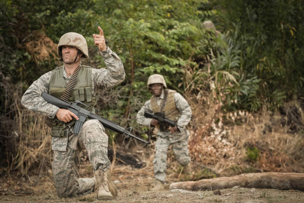 istock Military soldiers during training exercise with weapon 809982848