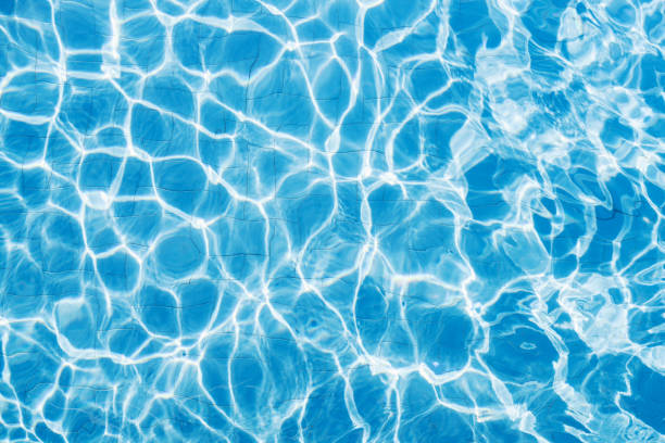 istock Ripple Water in swimming pool witn sun reflection 809985806