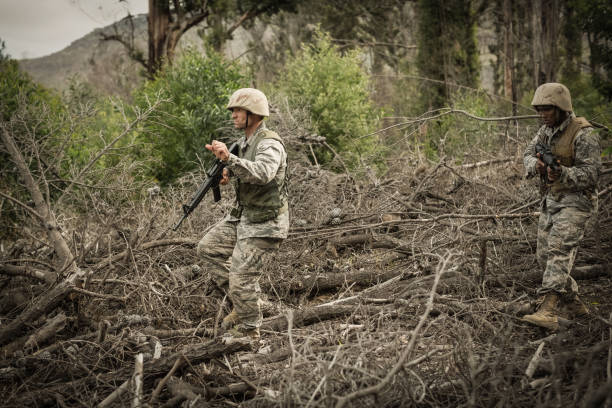 istock Military soldiers during training exercise with weapon 809985826