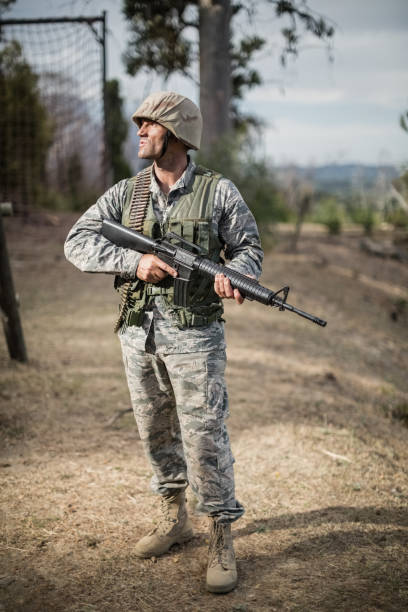 istock Military soldier during training exercise with weapon 809986318