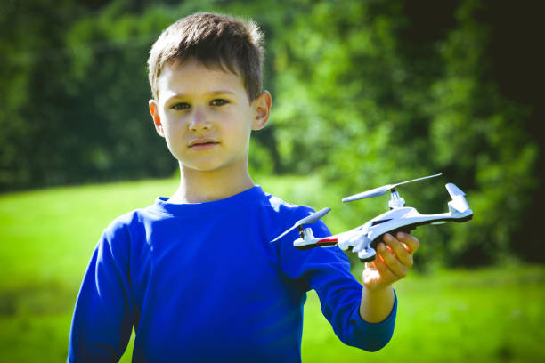 istock Boy playing with drone outdoors. 809986450