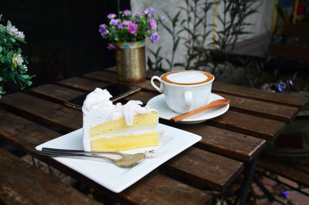 istock Latte Hot Coffee and Coconut Cake on table 809986522
