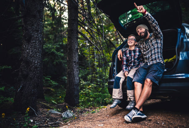 istock Father and son travelling by car 809987236