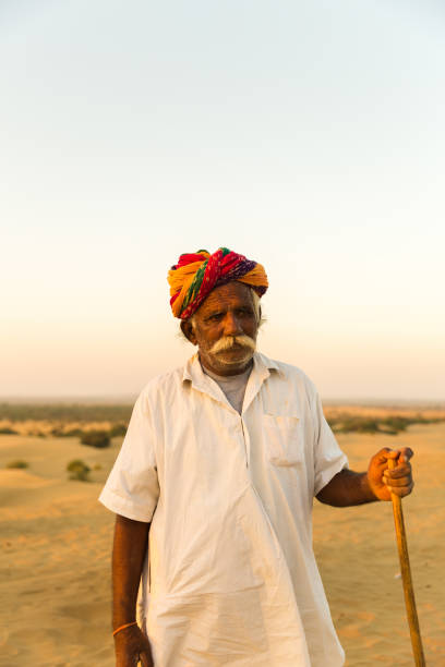 istock Rajasthani senior man in Jaisalmer Desert, India 810002618