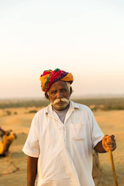 istock Rajasthani senior man in Jaisalmer Desert, India 810002670