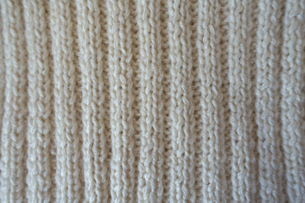 istock White handmade knitted fabric with vertical wales 810003224