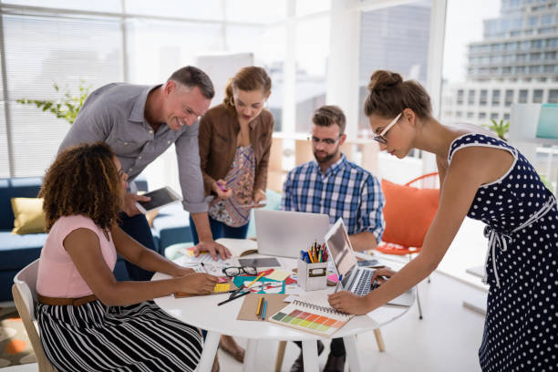 istock Team of executives working together in the office 810008764
