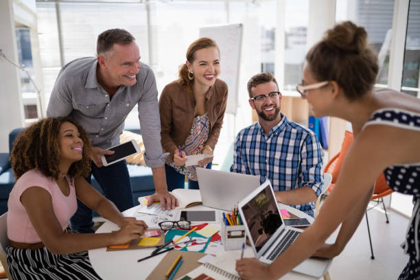 istock Team of executives working together in the office 810008824