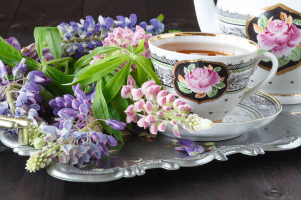 istock Composition with tea set and bouquet of beautiful spring flowers on tray 810012040