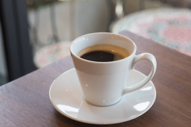 Cup of coffee on table in cafe ,Morning light