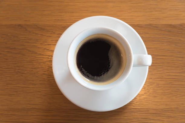 istock Cup of coffee on a wooden table 810019056
