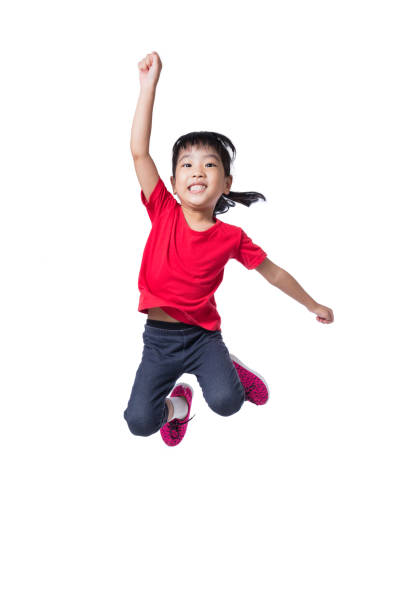 asian chinese little girl jumping up and wave her hands - gymnastics smiling little girls only isolated on white imagens e fotografias de stock